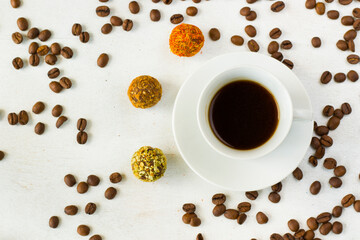Coffee espresso and truffles balls on the plate