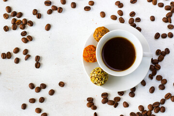 Coffee espresso and truffles balls on the plate