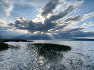 Sunset trough clouds at lake Balaton