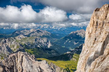 Fototapeta na wymiar Mountain landscape from Marmolada mountain peak in italian alps against blue sky