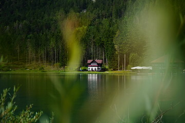 Typical alpine lonely house on Dobbiaco Lake, Dolomites, Unesco, Trentino Alto Adige, Sudtirol,...