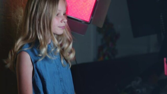 Teenage girl doing dance moves in self-isolation at home. Dance training via the Internet in a social distance. Obtaining new knowledge.