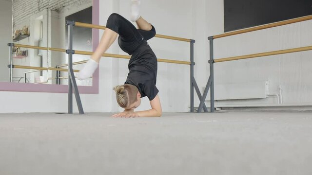 Young cool attractive man practicing yoga concept, Downward facing Tree pose, working out, full length.