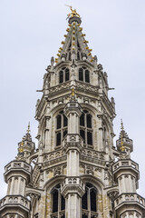 Fototapeta na wymiar Architectural fragment of Town Hall (Hotel de Ville) on Grand Place (Grote Markt), Brussels central square - most important tourist destination and most memorable landmark in Brussels, Belgium. 