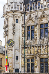 Obraz premium Architectural fragment of Town Hall (Hotel de Ville) on Grand Place (Grote Markt), Brussels central square - most important tourist destination and most memorable landmark in Brussels, Belgium. 