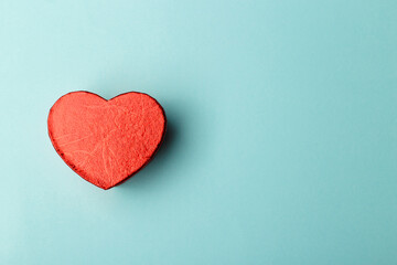 Red heart on blue background