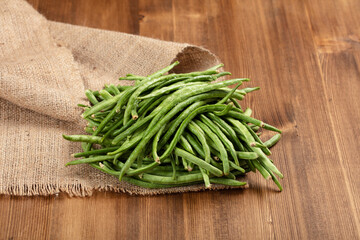 Green beans on wooden rustic table