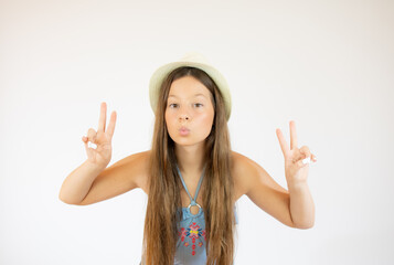 Girl with long hair making the victory gesture