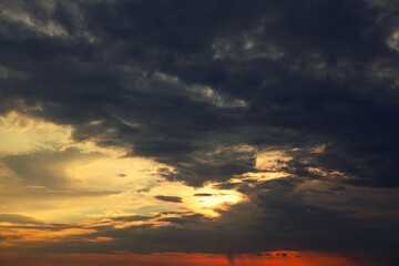 Fototapeta na wymiar Cinematic dark clouds before storm . Dramatic sky in the twilight