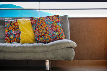 Gray sofa with colorful cushions