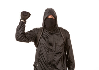 Protestor giving a power signal to the camera while posing in front of a white background.