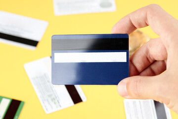 person holding at his hand blank debit or credit card. template for design. solvency concept
