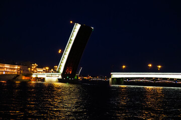 Fototapeta na wymiar Open bridge in Saint Petersburg, Russia. Liteiny bridge at night. Divorced Liteiny Bridge