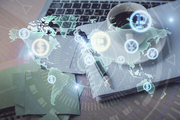 Double exposure of forex chart drawing and desktop with coffee and items on table background. Concept of financial market trading