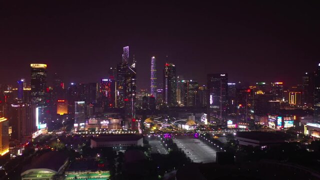 night time illuminated guangzhou city downtown sports ground aerial panorama 4k china