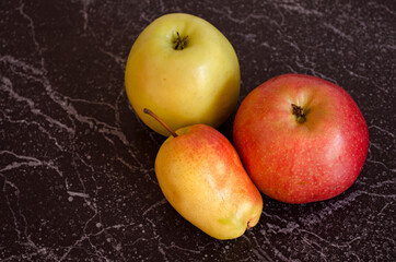 Fruits on the table top view. Fresh apples and pear. 