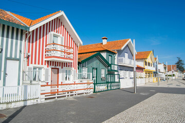Fototapeta na wymiar Colorful houses on the beach of Costa Nova, Aveiro, Portugal