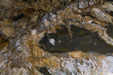 PETAR - Alto Ribeira Tourist State Park. Internal images of caves, with geological formations of water dripping from the ceiling, forming stalactites and stalagmites formed on the floor. 