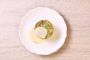 Spinach egg white frittatas on white plate