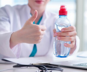 The doctor hand with fresh water in medical concept