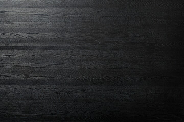 艶のある黒い木製のボードの背景テクスチャー