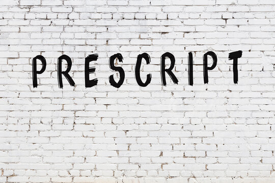 Inscription prescript painted on white brick wall