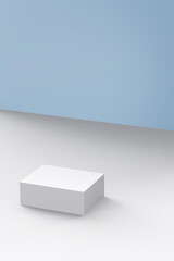a white box lying on a blue background and white floor.