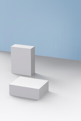 white boxes lying on a blue background and white floor.