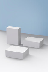 white boxes lying on a blue background and white floor.