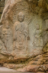 Fototapeta na wymiar Rock-carved Buddha triad of Yonghyeon-ri