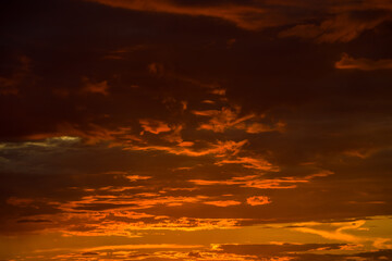 Fototapeta premium Beautiful sunset sky and clouds. Dramatic orange, red sky. 