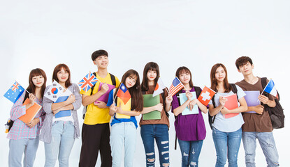 happy teenager student group standing together and showing the flags