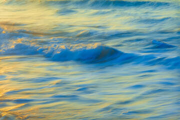 Closeup of incoming whitewater wave, motion blur