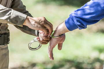 police helped to catch the guilty and lock the handcuffs,arrested.