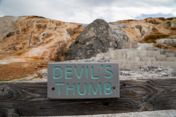Sign for Devils Thumb, a hot spring mineral formation in Yellowstone National Park