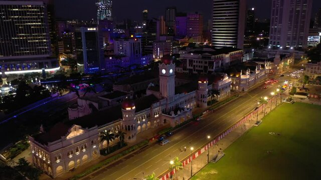 night time illumination kuala lumpur city famous palace riverside bay traffic street aerial topdown panorama 4k malaysia