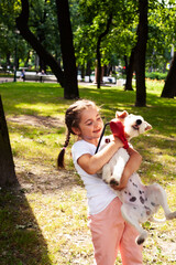 little cute girl outside playing with dog, lifestyle people concept