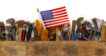 Patriotic collection of worn and used work tools with small US American flag. Made in USA, American...