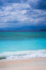 tropical beach with blue sky and clouds