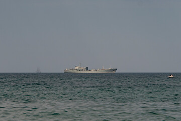 Fishing boat on the sea horizon.