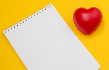 Blank medical with heart on yellow background. Copy space.