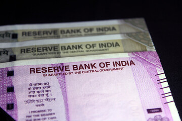 New Indian currency. 500, and 2000 rupee notes. Indian currency isolated on black background.