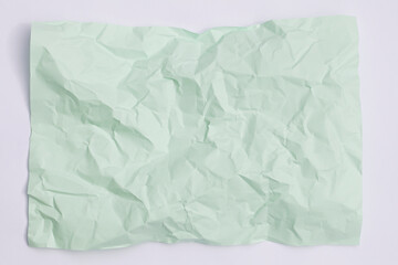 Obraz premium green crumpled paper background, texture for web design screensavers.
