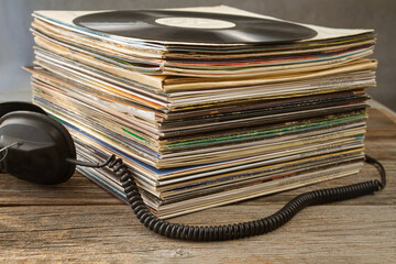 Naklejka premium Headphones and favorite old vinyl records.