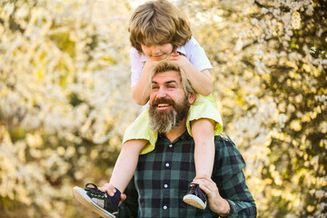 Happy family. Fatherhood happiness. Fathers day. Earth day. Little boy and father in nature background. Hipster and baby son. Happiness concept. Spring walk. Ecology and environment. Simple happiness