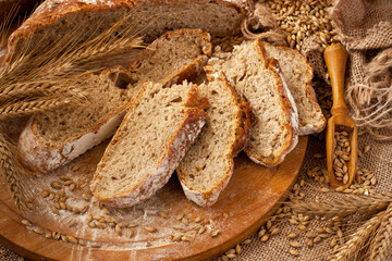 Bread slices on wooden  board, rustic style