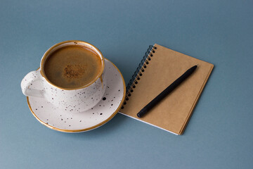 Cup of coffee and notebook. Minimalism style. © Тетяна Романчук
