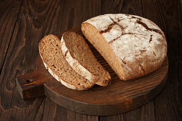 Bread slices on wooden table background