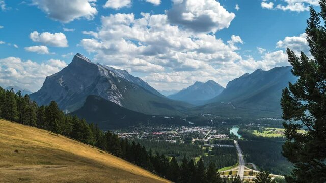 Banff National Park, Alberta, Canada, time lapse view of Banff village and Mount Rundle on a beautiful summer day.