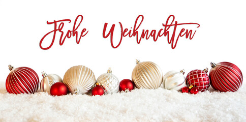 German Calligraphy Frohe Weihnachten Means Merry Christmas On Isolated White Backgroud. Red And White Festive Christmas Ball Ornament On Snow.